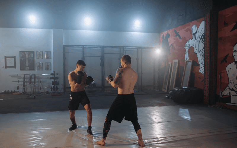 Two fighters demonstrating MMA techniques to prevent injuries